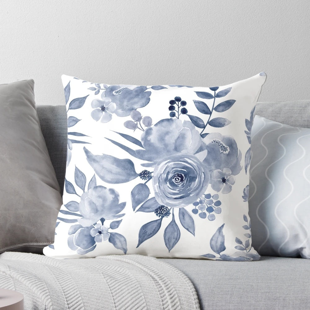 Decorative floral pillow in a Hamptons-inspired blue and white color palette