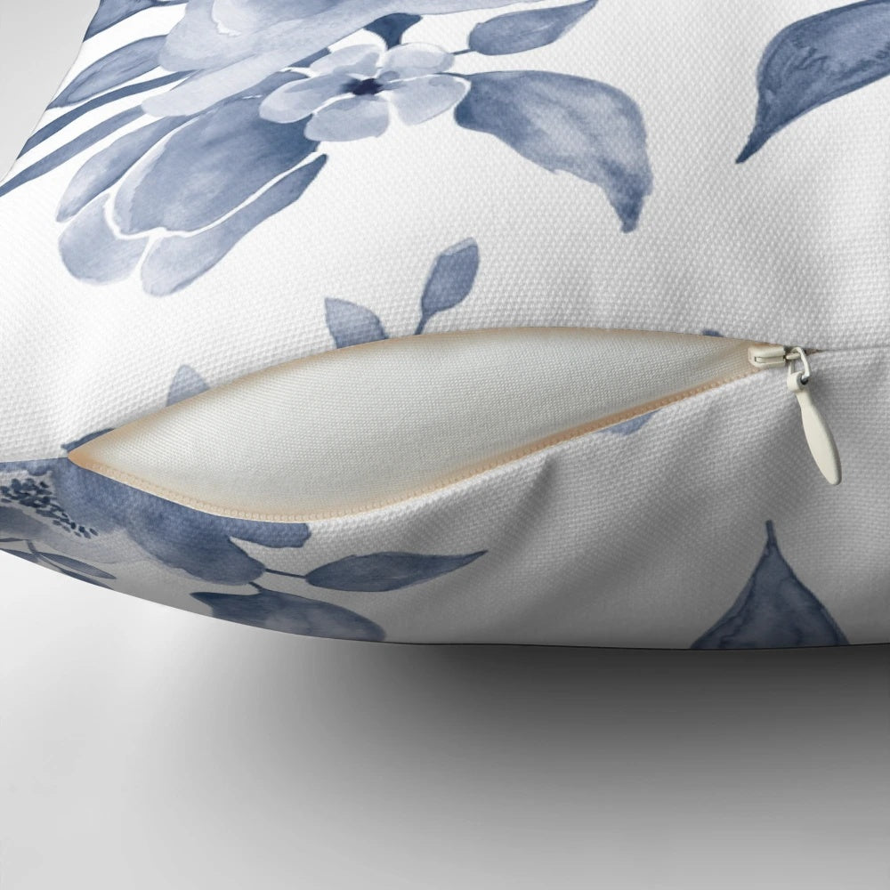 Decorative floral pillow in a Hamptons-inspired blue and white color palette