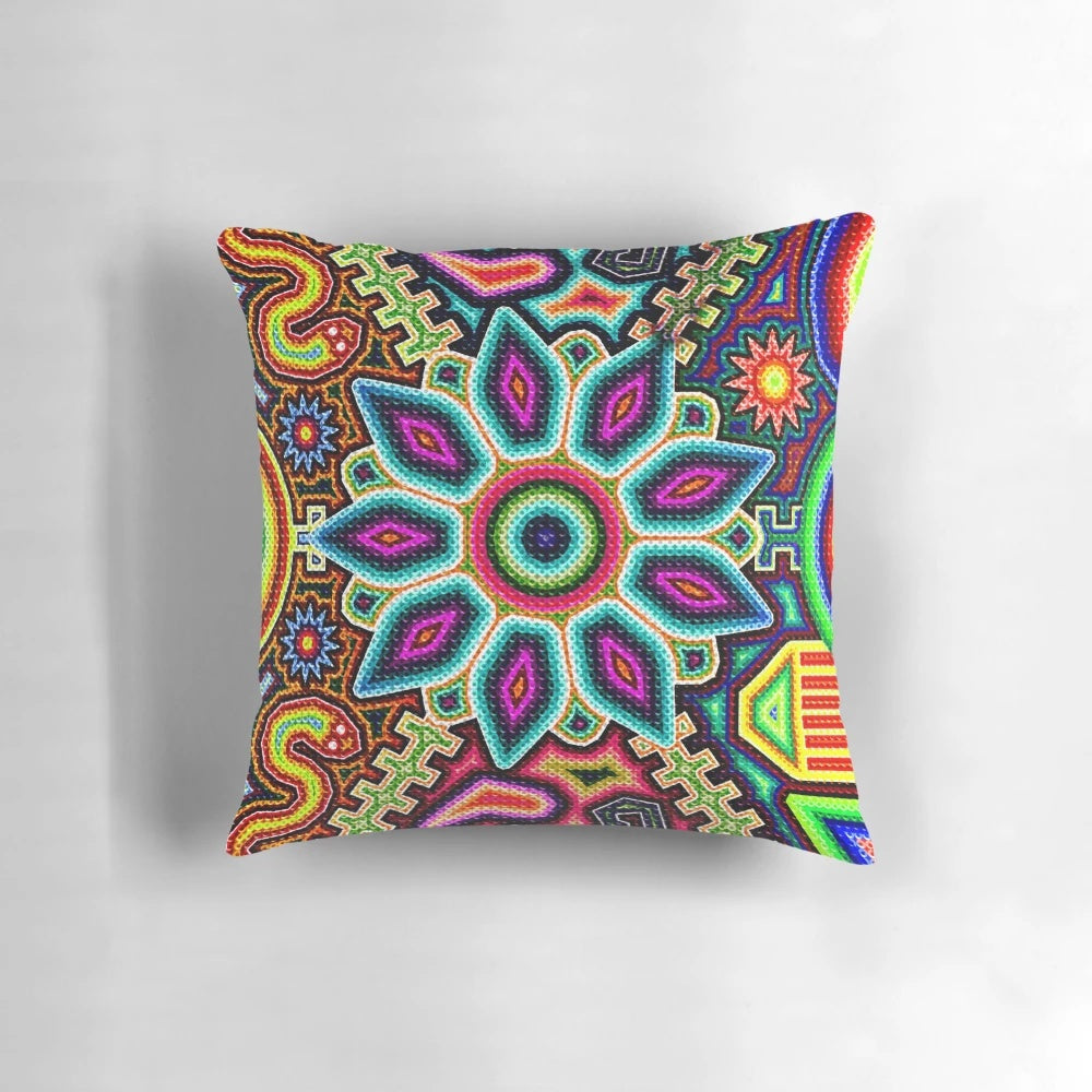 Colorful, handmade Huichol art pillow featuring traditional Mexican designs and patterns