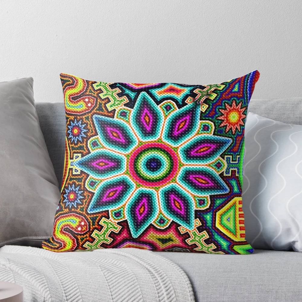 Colorful, handmade Huichol art pillow featuring traditional Mexican designs and patterns