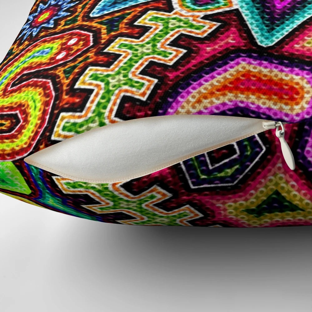 Colorful, handmade Huichol art pillow featuring traditional Mexican designs and patterns