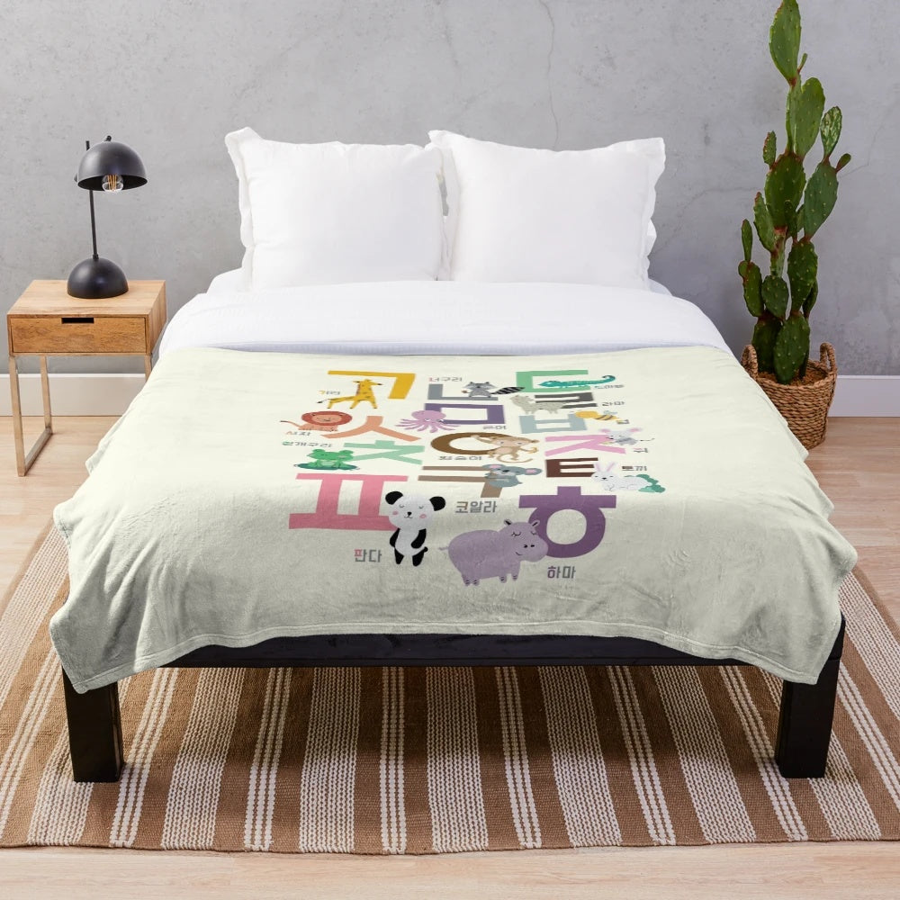 Plush blanket featuring hand-drawn illustrations of Korean alphabet and cute animals