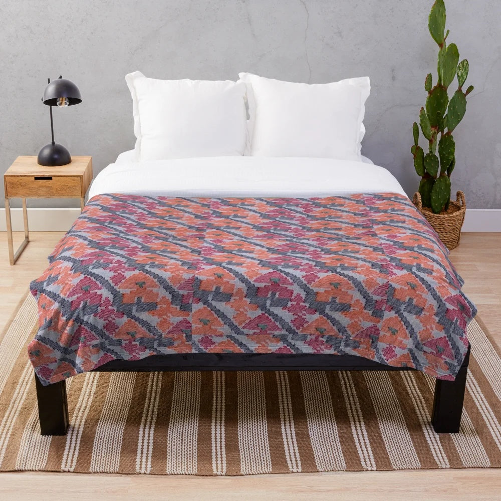 Handcrafted plush blanket featuring a vibrant Nepali art inspired design