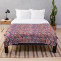 Handcrafted plush blanket featuring a vibrant Nepali art inspired design
