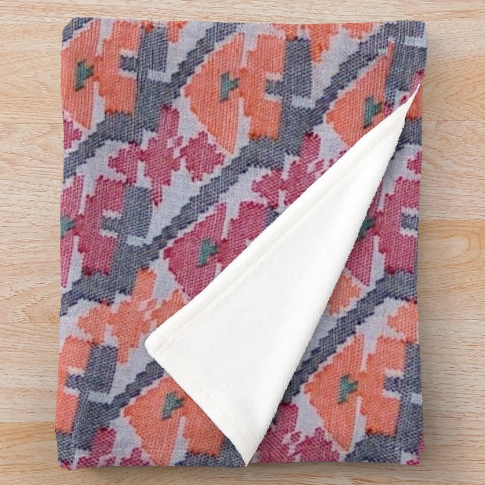 Handcrafted plush blanket featuring a vibrant Nepali art inspired design