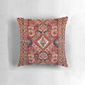 Photograph of a beautifully crafted oriental rug pillow, featuring intricate patterns and vibrant colors.