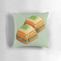 Watercolor illustration of pistachio baklava on a soft, cozy pillow