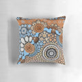 Handmade pillow featuring authentic indigenous dot painting art inspired by the river landscape