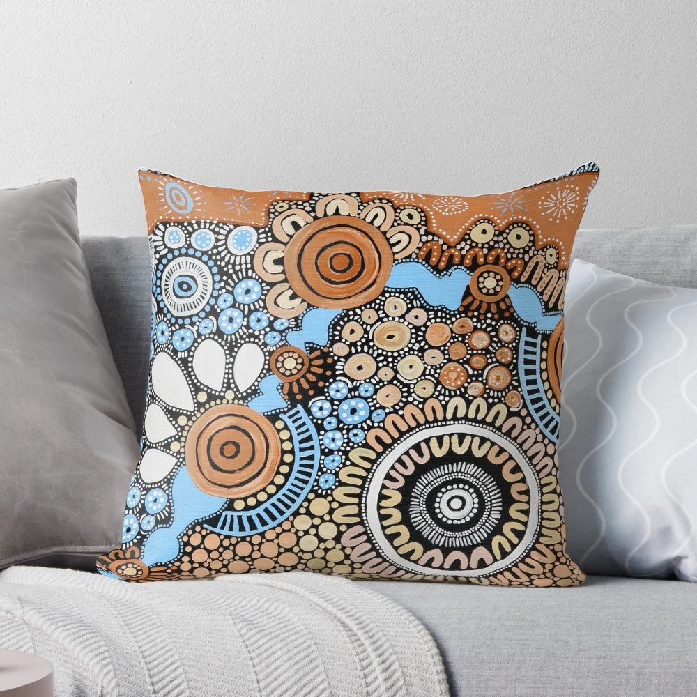 Handmade pillow featuring authentic indigenous dot painting art inspired by the river landscape