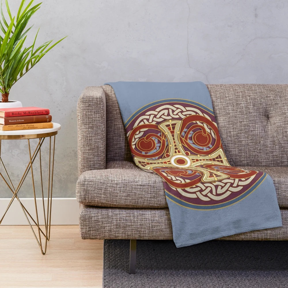 St Cuthbert plush blanket featuring a traditional Celtic knot pattern