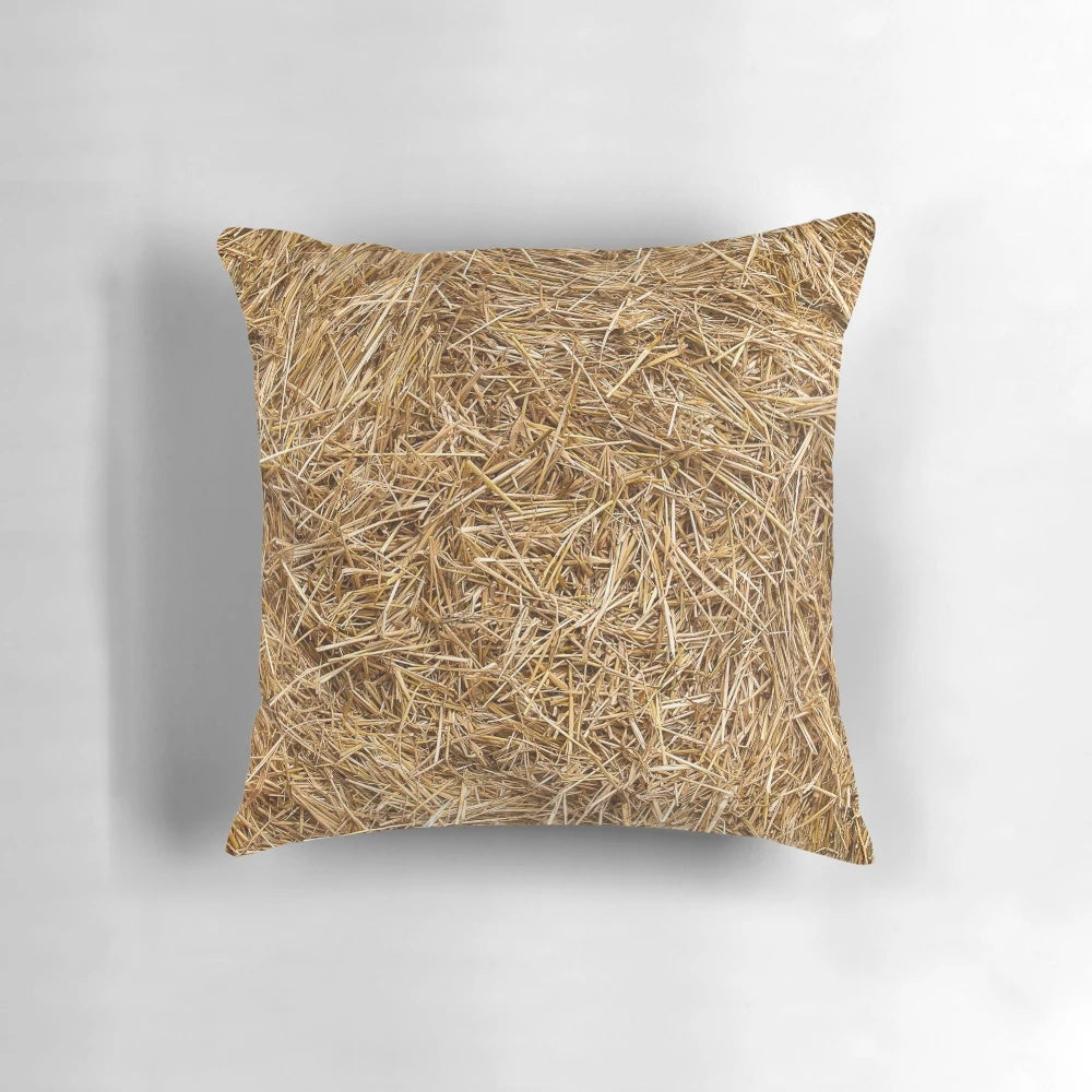 Closeup of a decorative straw and hay pillow with a natural, rustic pattern