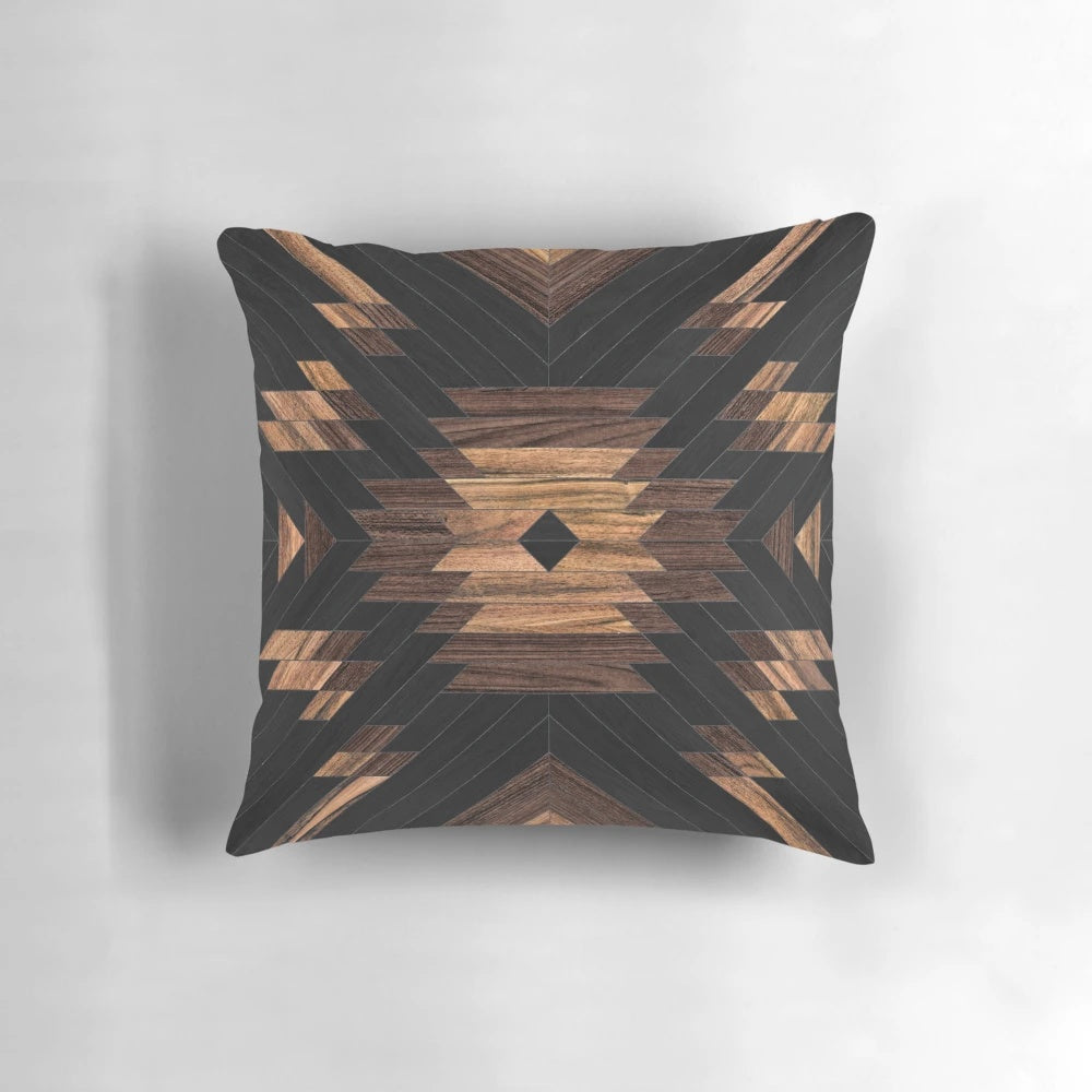 Handcrafted wood pillow featuring a bold tribal pattern design
