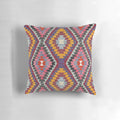 Closeup of a vibrant, multicolored Turkish kilim pattern pillow.