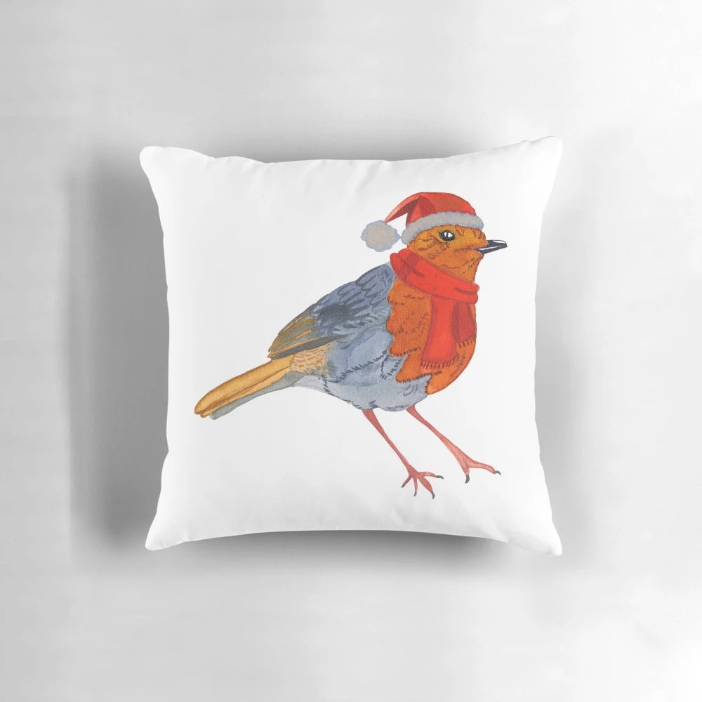 A beautiful watercolor painting of a robin bird on a soft, decorative throw pillow.