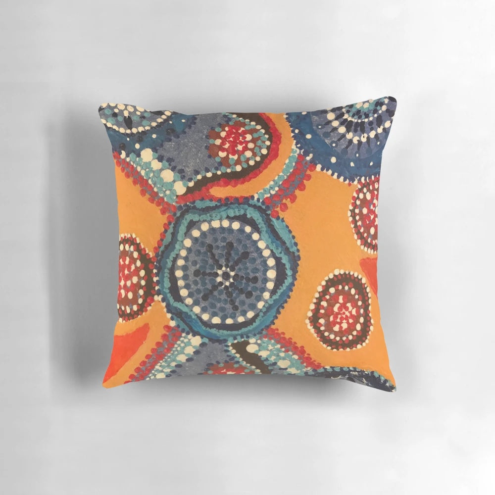 Vibrant aboriginal dot art pillow featuring a river miles design by Australian artist Melody Chime