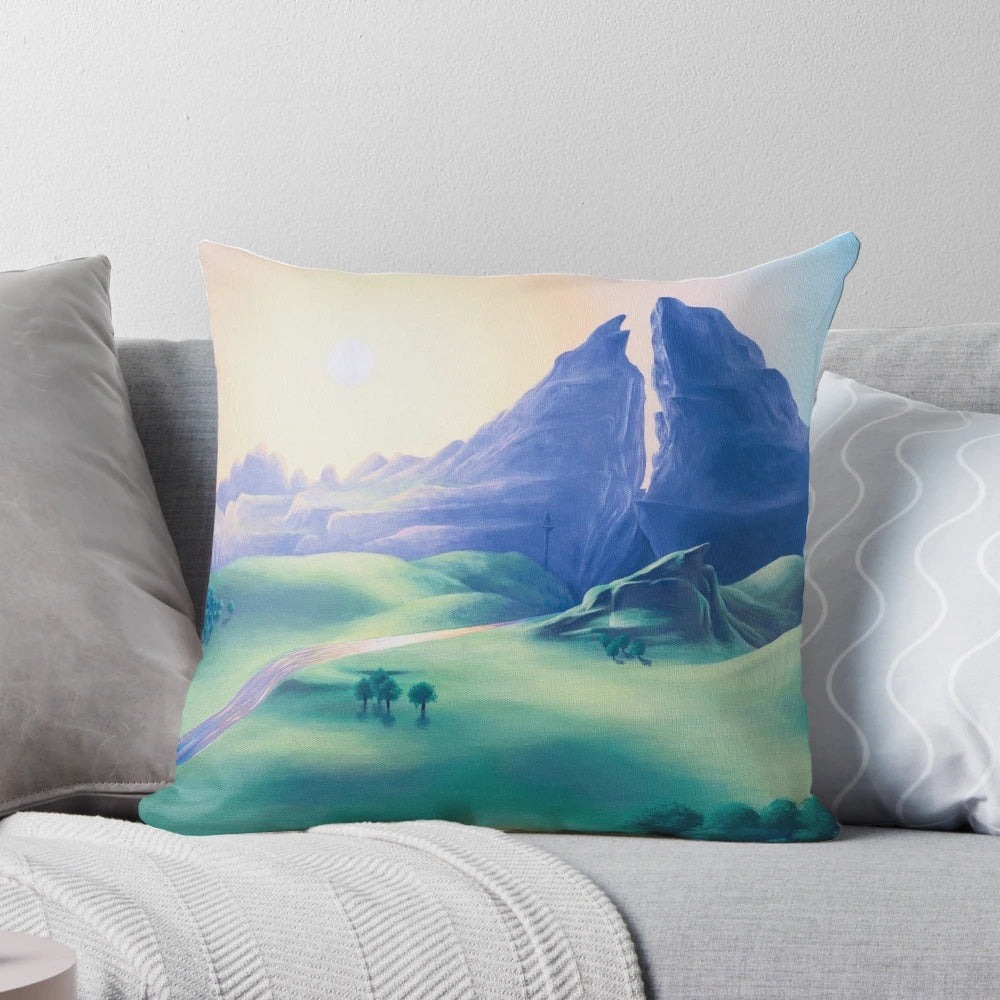 Close-up of a vibrant, abstract geometric pillow in shades of blue, pink, and white.