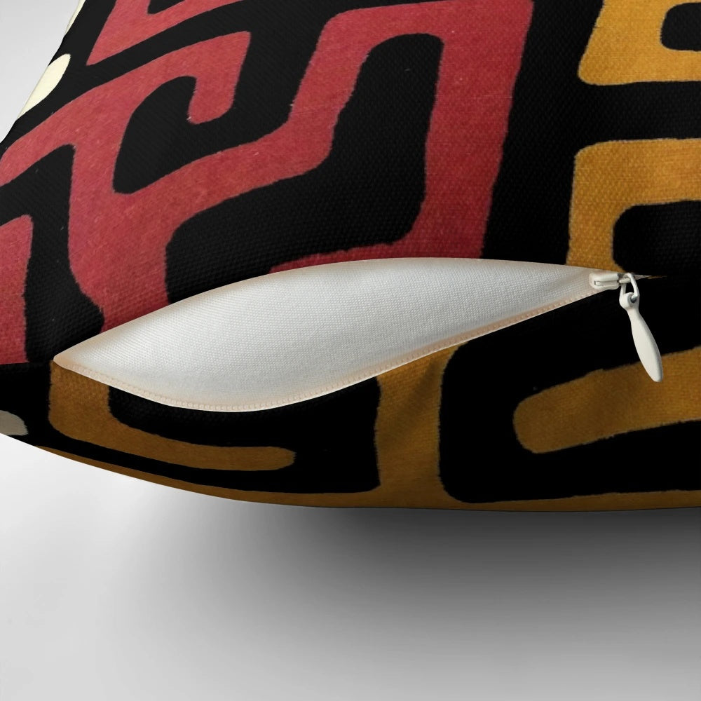 African-inspired mudcloth design throw pillow in black, white, and metallic gold tones