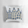 Delft blue and white decorative pillow with classic Dutch canal house design