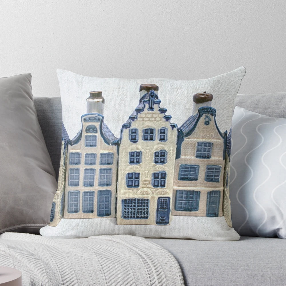 Delft blue and white decorative pillow with classic Dutch canal house design