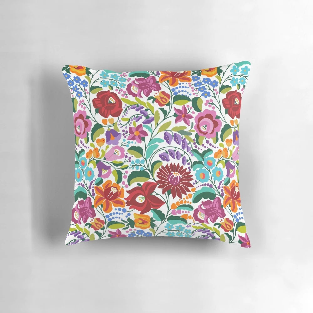Vibrant Hungarian Kalocsai embroidery pattern on a decorative throw pillow