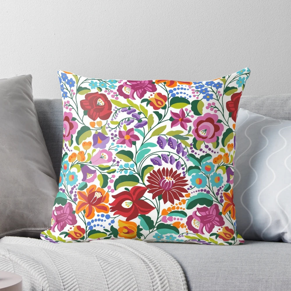 Vibrant Hungarian Kalocsai embroidery pattern on a decorative throw pillow