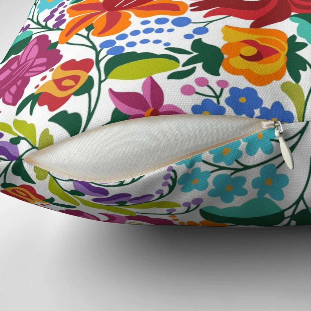 Vibrant Hungarian Kalocsai embroidery pattern on a decorative throw pillow