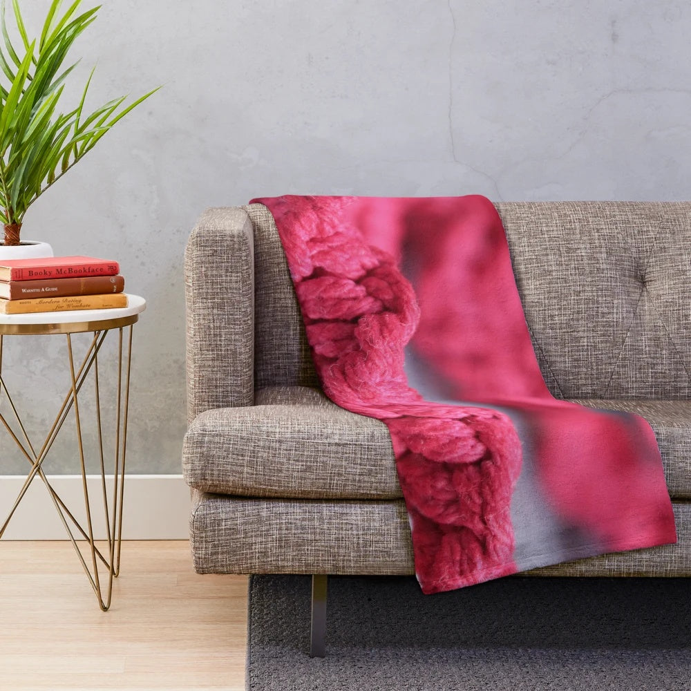Handmade macrame plush blanket in soft pink and red colors