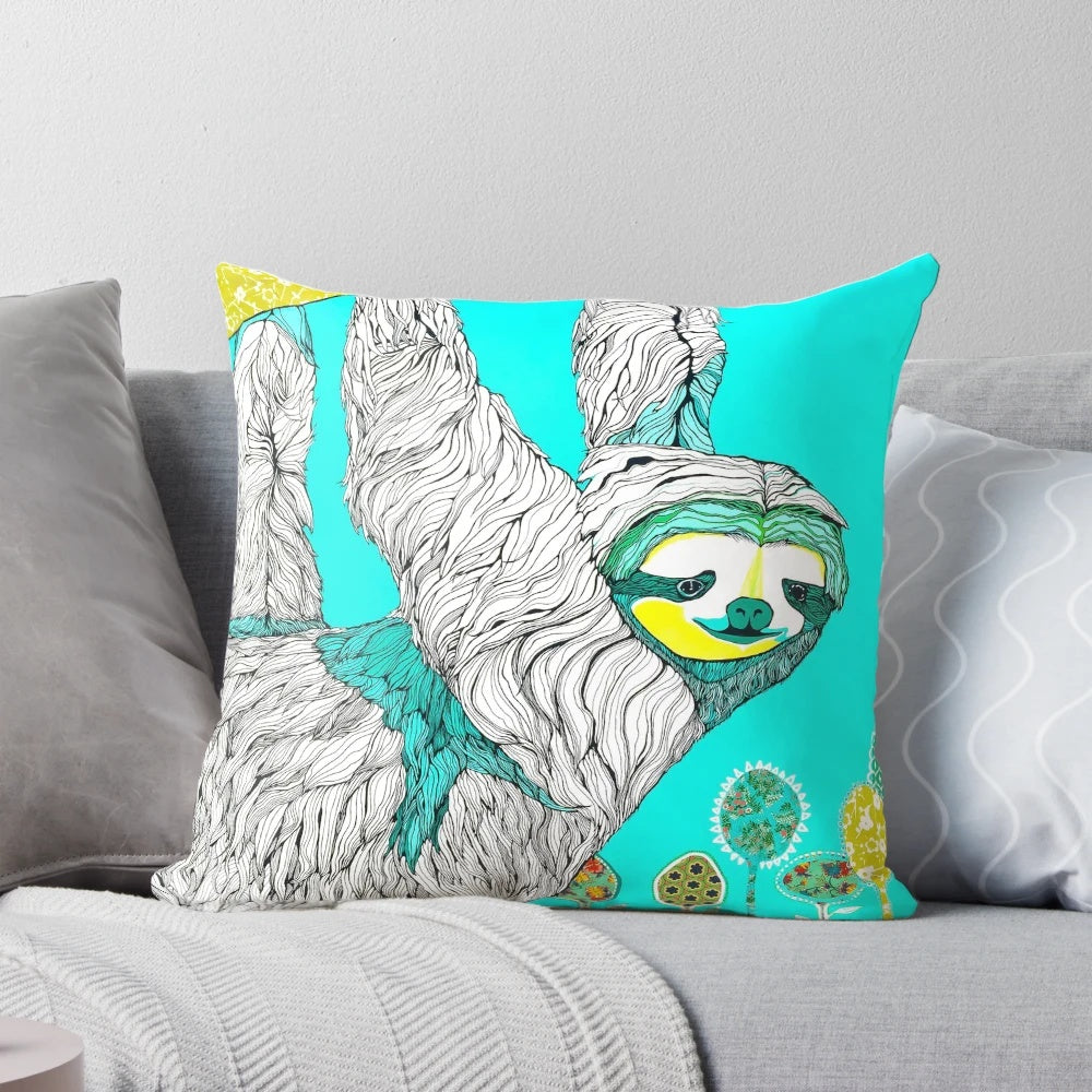 A handmade spring-themed pillow featuring a sloth design in a mixed media collage style with floral elements.