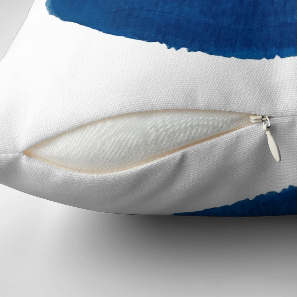 Vibrant watercolor painting of an evil eye (nazar) talisman on a decorative throw pillow.