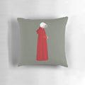 The Handmaid's Tale inspired decorative pillow featuring iconic quotes and imagery from the popular Hulu series.