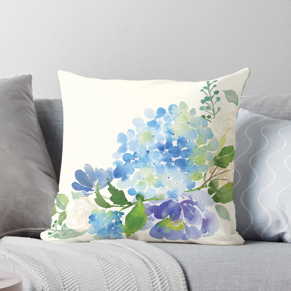 A beautiful blue watercolor hydrangea floral design on a decorative throw pillow.