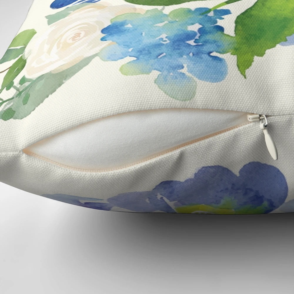 A beautiful blue watercolor hydrangea floral design on a decorative throw pillow.