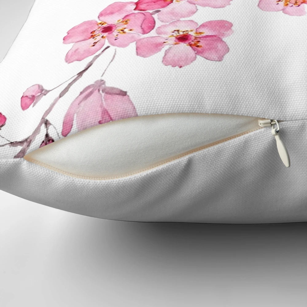 Handpainted pink cherry blossom watercolor design on a decorative throw pillow