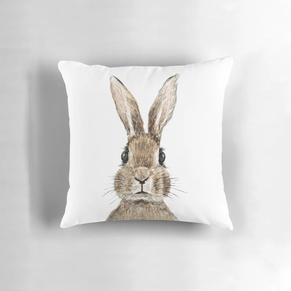 Handpainted watercolor painting of a cute rabbit on a decorative throw pillow