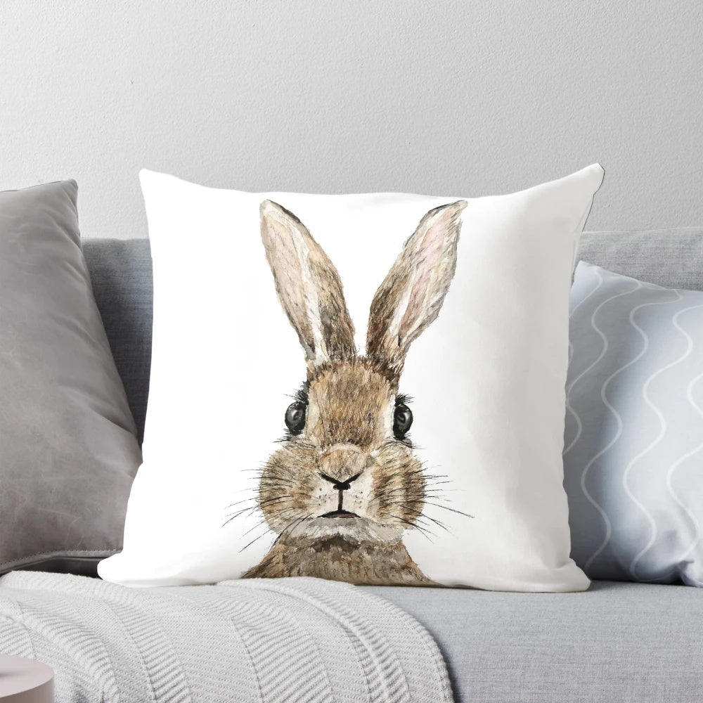 Handpainted watercolor painting of a cute rabbit on a decorative throw pillow