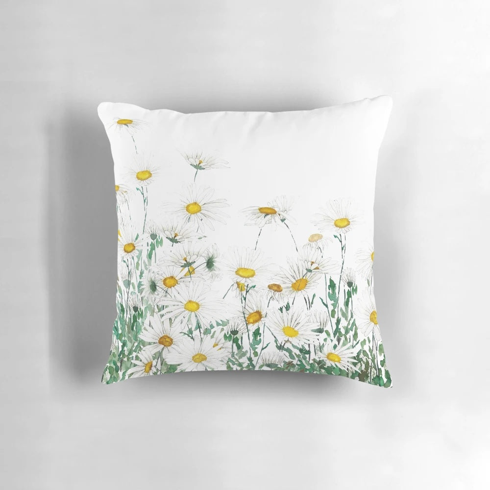 Handpainted white daisy watercolor artwork on a decorative throw pillow