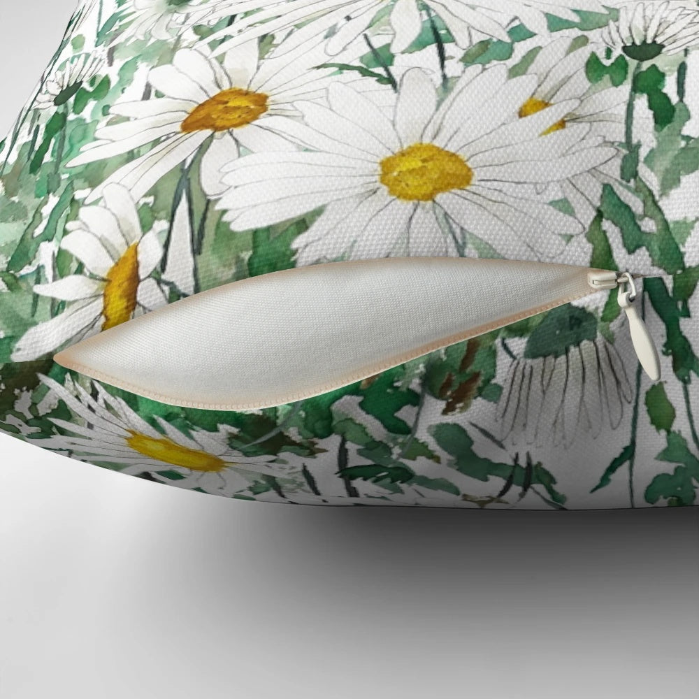 Handpainted white daisy watercolor artwork on a decorative throw pillow