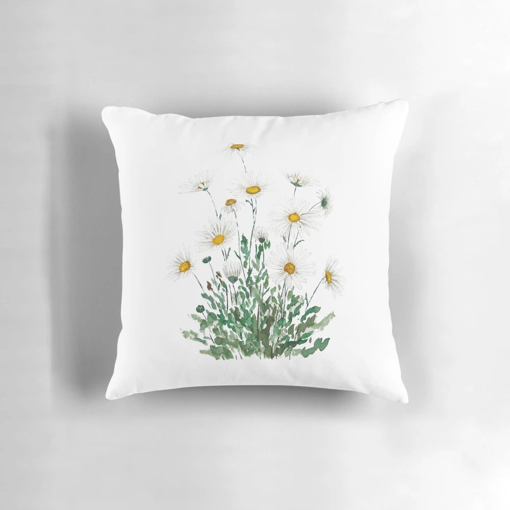 A handpainted white margaret daisy watercolor throw pillow, featuring a nature-inspired floral design.