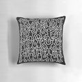 Black and white throw pillow featuring the iconic artwork of Keith Haring