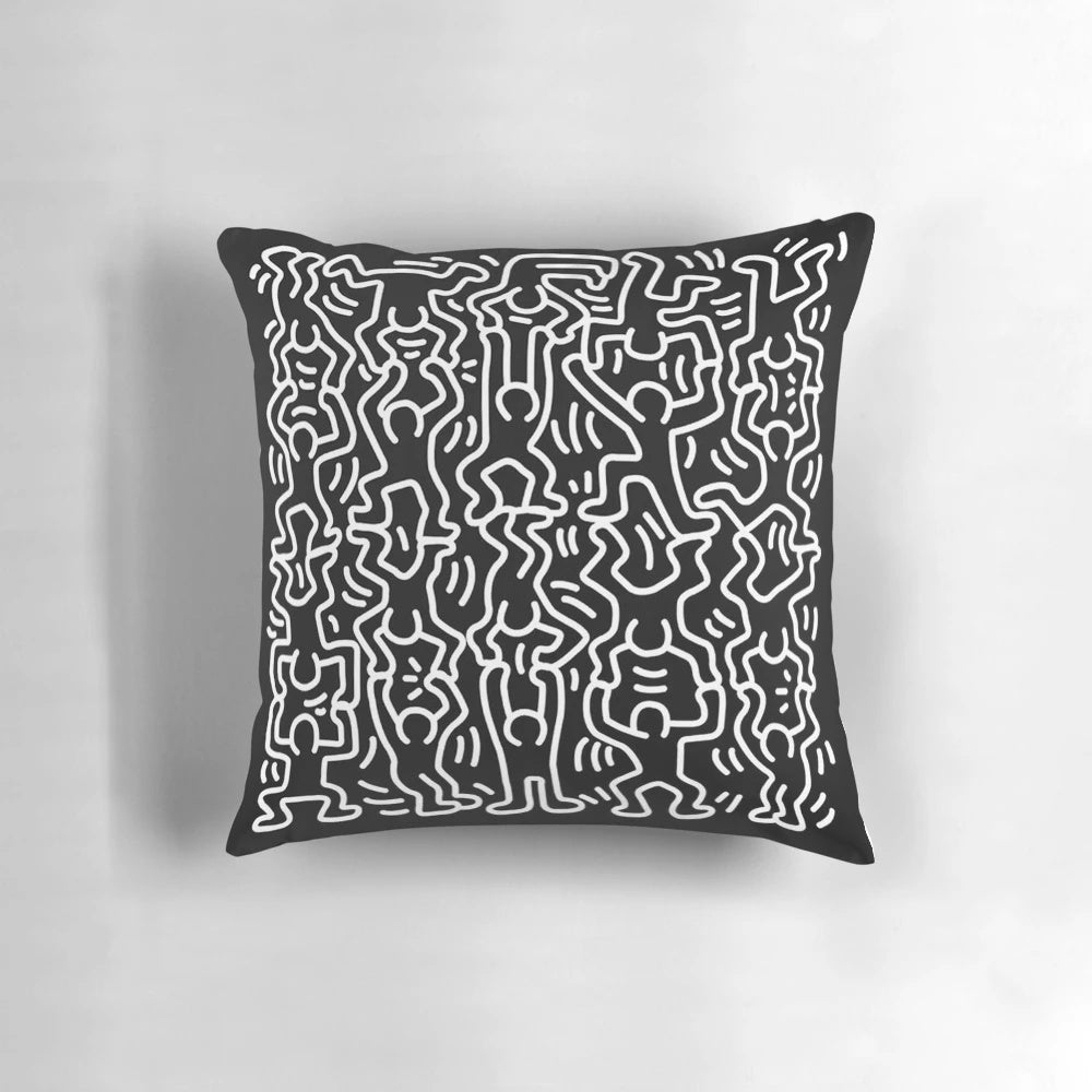 Black and white throw pillow featuring the iconic artwork of Keith Haring