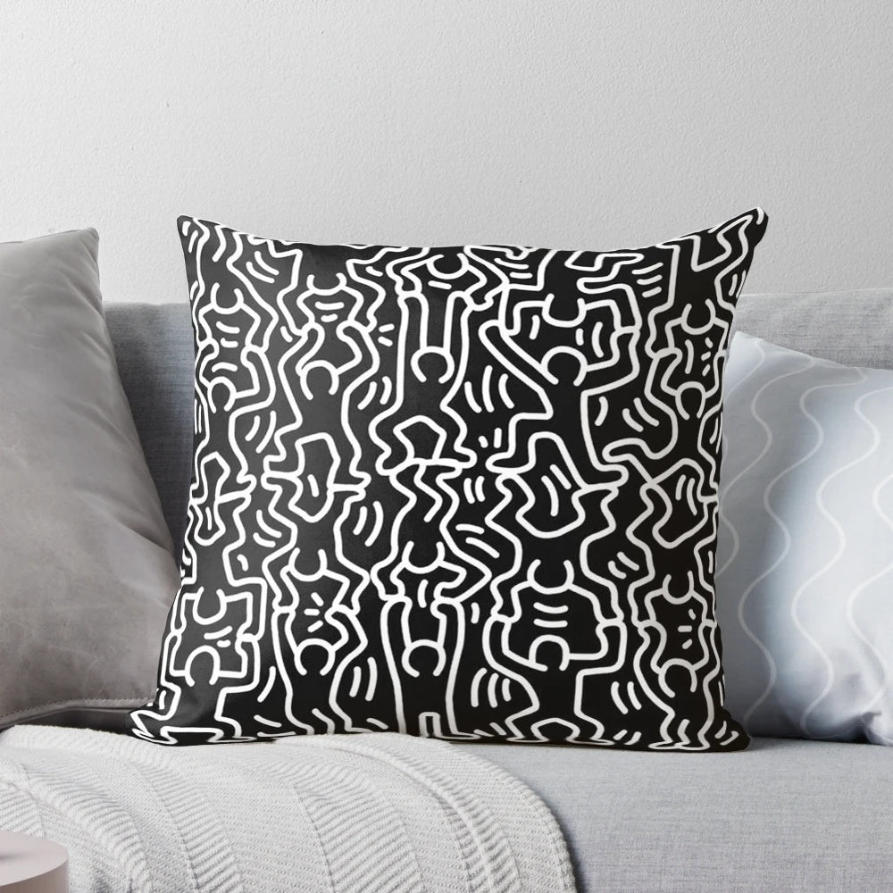 Black and white throw pillow featuring the iconic artwork of Keith Haring