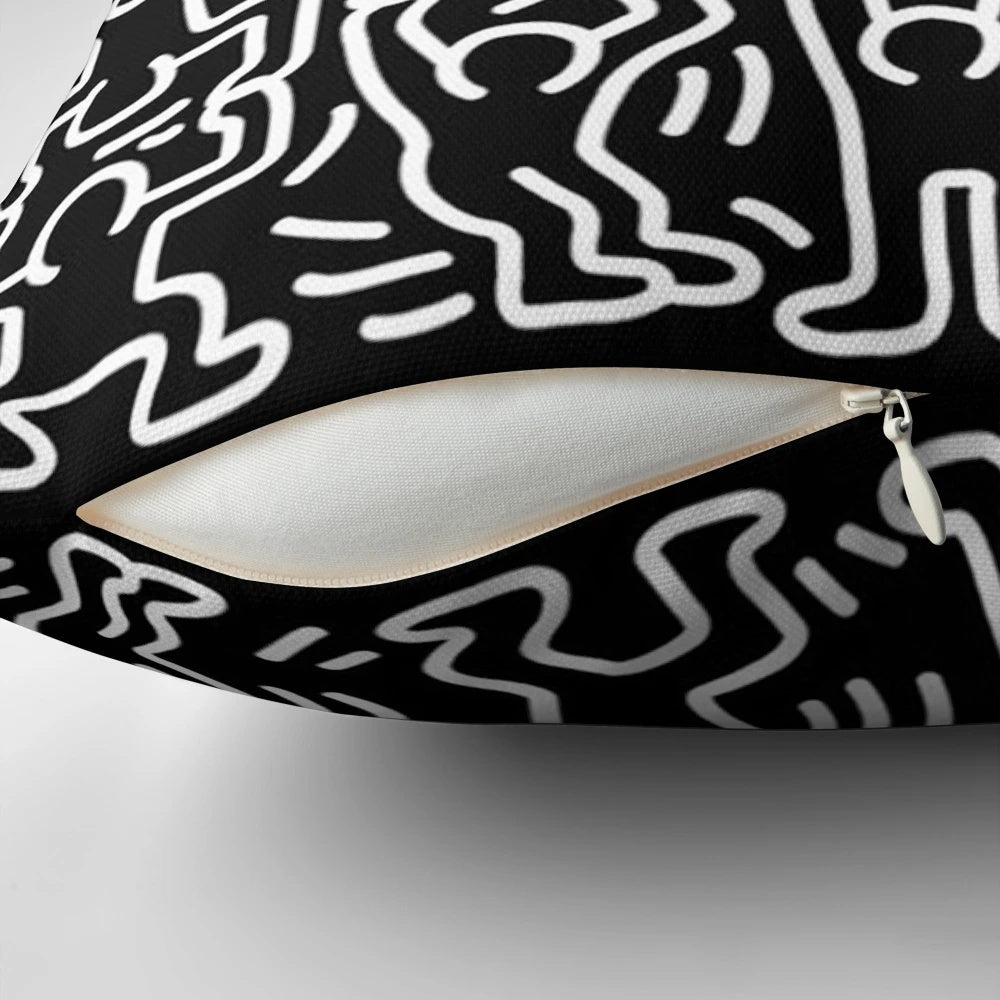 Black and white throw pillow featuring the iconic artwork of Keith Haring