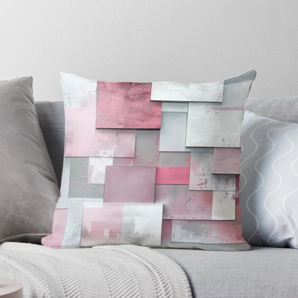 Soft, modern pillow in a harmonious geometric pattern featuring shades of gray and pink.