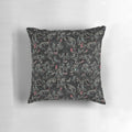 A grey and black wolf pack pattern pillow with snarling timber wolves
