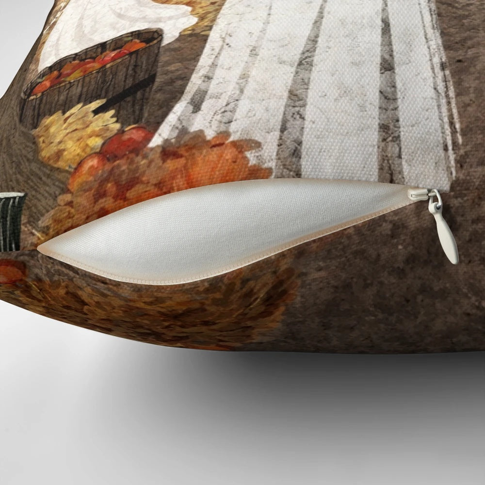 A cozy, autumn-themed pillow featuring a haunted orchard landscape with ghost, pumpkins, and falling leaves.