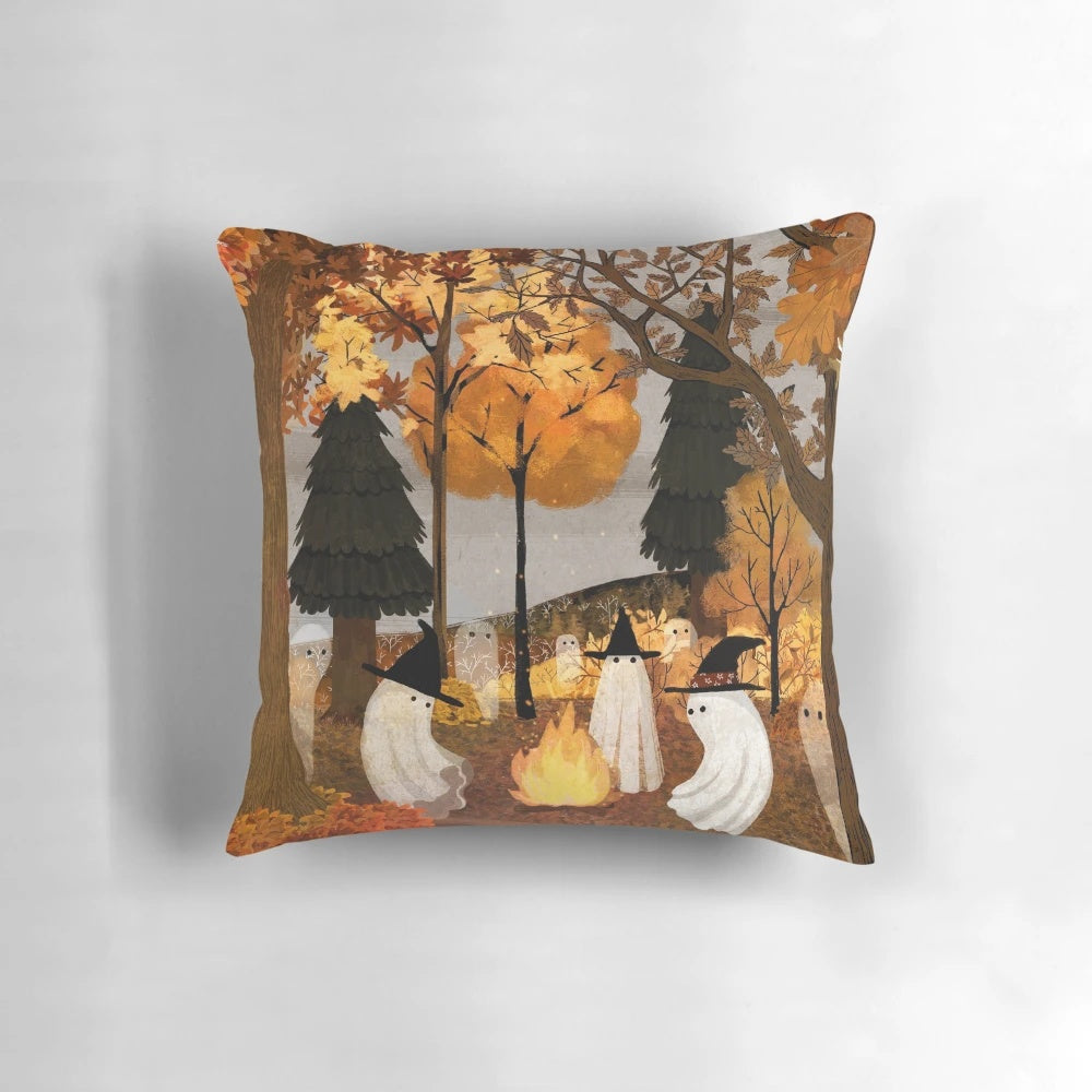 Haunted forest pillow with autumn leaves and campfire imagery