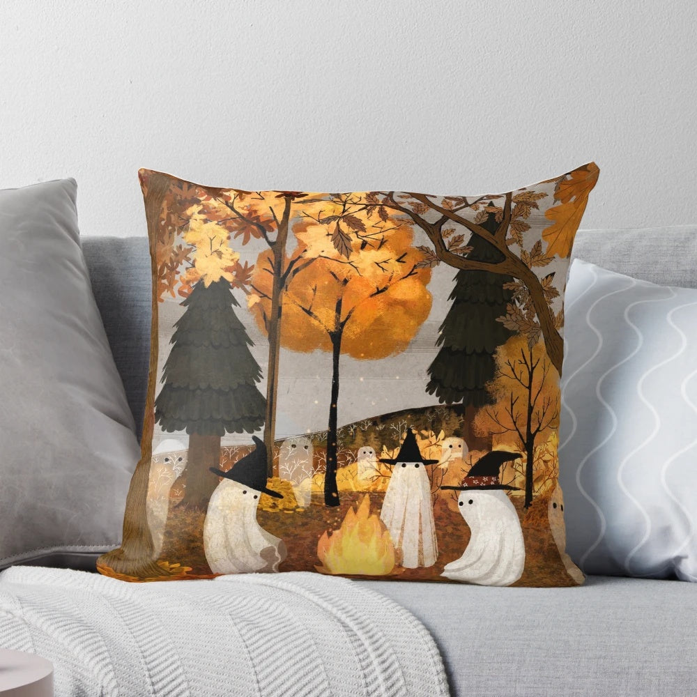Haunted forest pillow with autumn leaves and campfire imagery