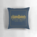 Pillow with Button House Hotel and Spa logo, featuring ghosts and haunted house elements