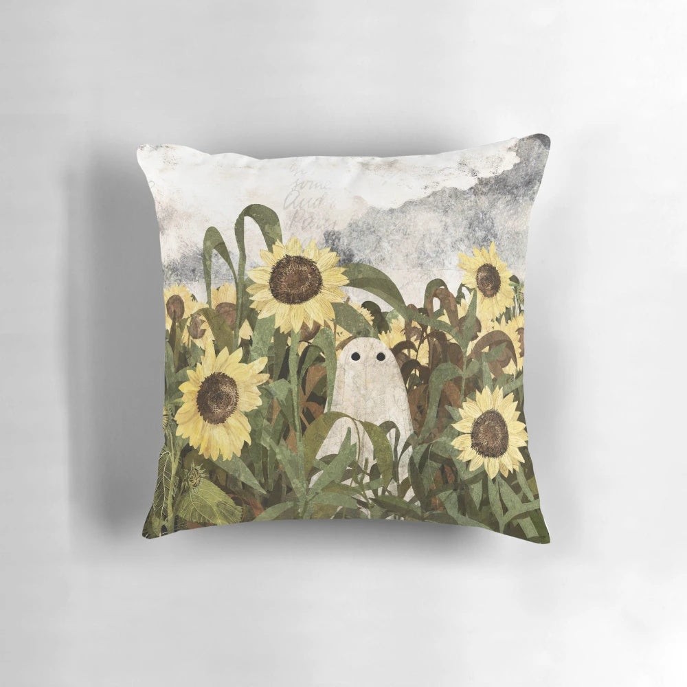 Vintage throw pillow with a ghostly figure in a sunflower field against a cloudy, heatwave sky