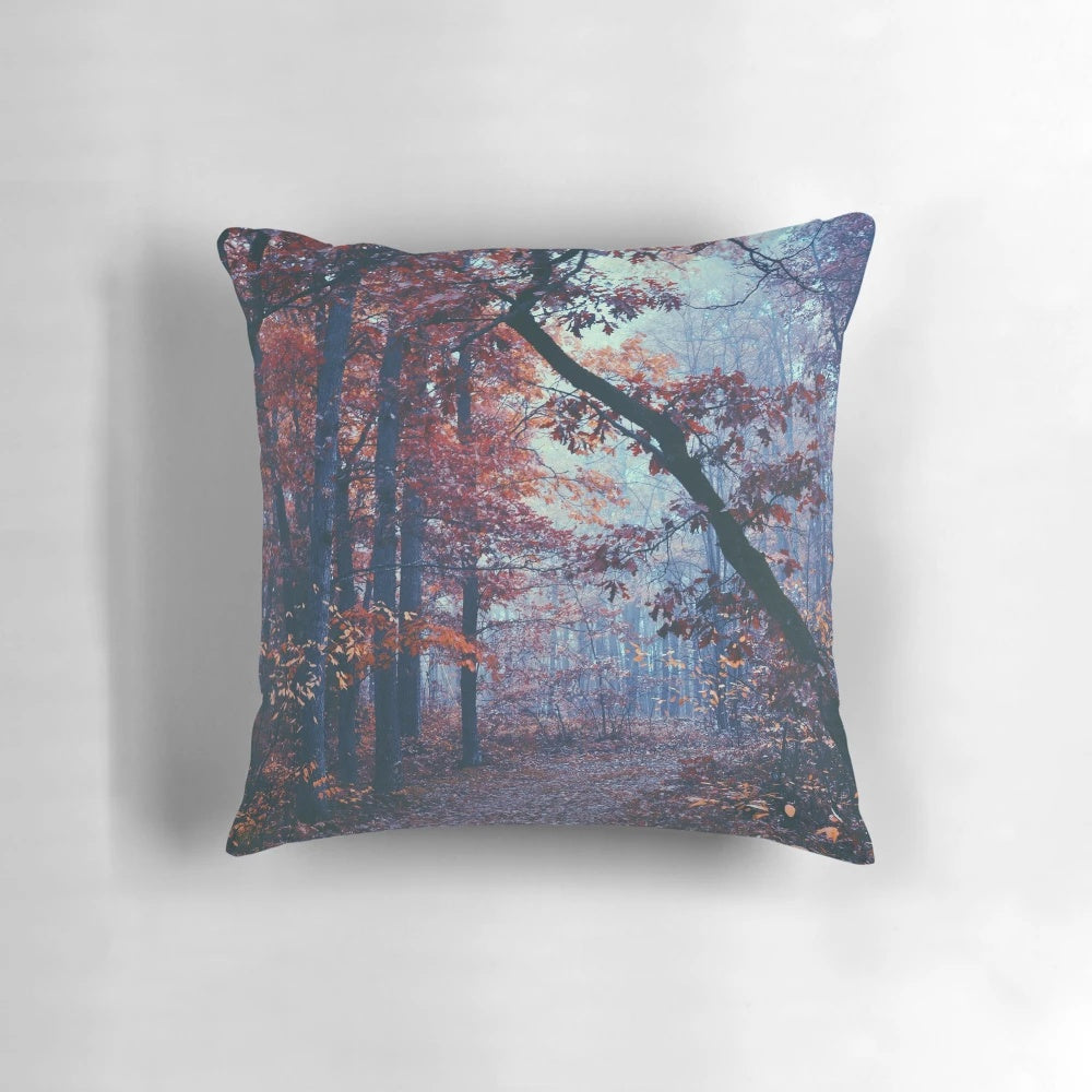 A haunting autumn landscape with a misty, foggy forest and dark, moody atmosphere.